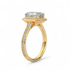 Side angle view of a 4 CT emerald cut lab diamond halo ring with pave band in yellow gold.