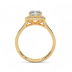 Side profile elevation view of a 4 carat emerald cut lab diamond halo ring in yellow gold.