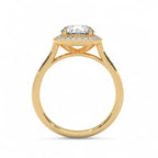 Side profile view of a yellow gold 3 CT round lab grown diamond halo engagement ring with a plain band.