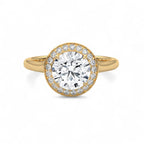 Top view of a 3 CT round cut lab grown diamond halo ring in yellow gold.
