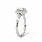 Angled view showing the halo setting and plain band of a white gold 3 carat round lab diamond ring.