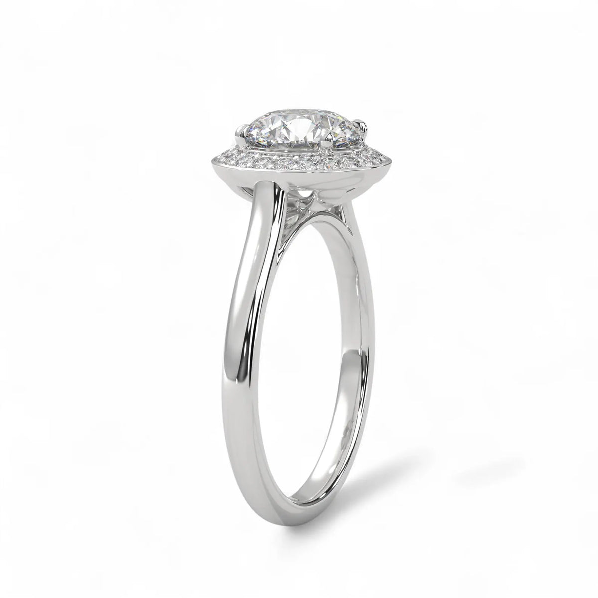 Angled view showing the halo setting and plain band of a white gold 3 carat round lab diamond ring.