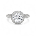 Top view of a white gold 3 carat round cut lab grown diamond halo engagement ring.