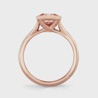 Straight side profile of a 2 carat pink cushion cut lab diamond ring set in a polished rose gold bezel setting.