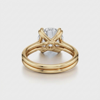 Perspective back view of a yellow gold 2 CT round lab diamond ring showcasing the double wire band and undergallery.