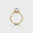 Straight side profile view of a yellow gold 2 carat round lab grown diamond solitaire engagement ring.