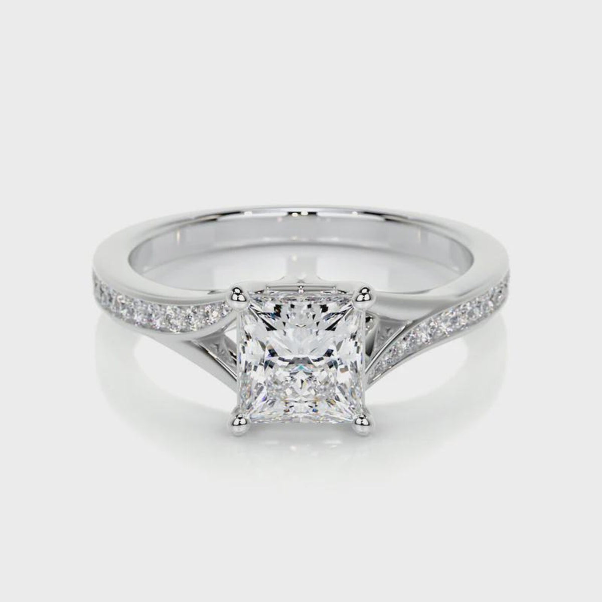 Front view of a 2 CT princess cut lab grown diamond engagement ring in white gold with pave split shank.
