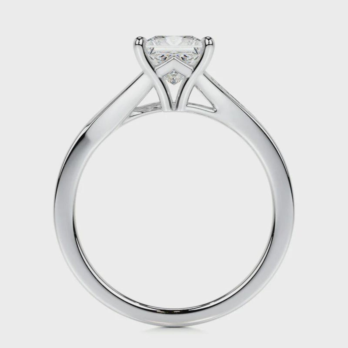 Full side profile view of a white gold 2 CT princess cut lab diamond engagement ring showing cathedral basket.