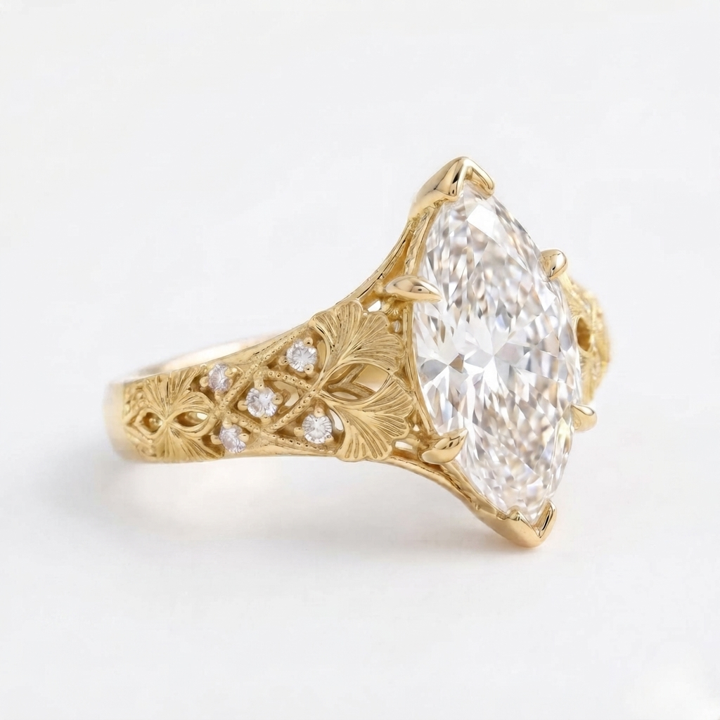 Close-up side profile of a 4 carat marquise lab diamond ring in yellow gold with embedded accent diamonds.