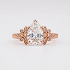 Front top-down view of a 3 CT pear cut lab grown diamond vintage engagement ring set in 14K rose gold.