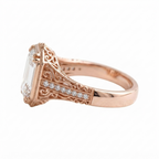 Detailed side profile of a rose gold 5 carat emerald cut lab diamond engagement ring with openwork scroll design.