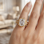 Close-up view of a woman wearing a 5 CT emerald cut lab grown diamond vintage engagement ring in yellow gold.
