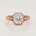 Front top view of a 3 CT cushion cut lab diamond engagement ring in rose gold showing scalloped frame and marquise side accents.