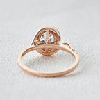 Bottom profile view showing the structural open gallery and setting architecture of the rose gold oval lab diamond ring.