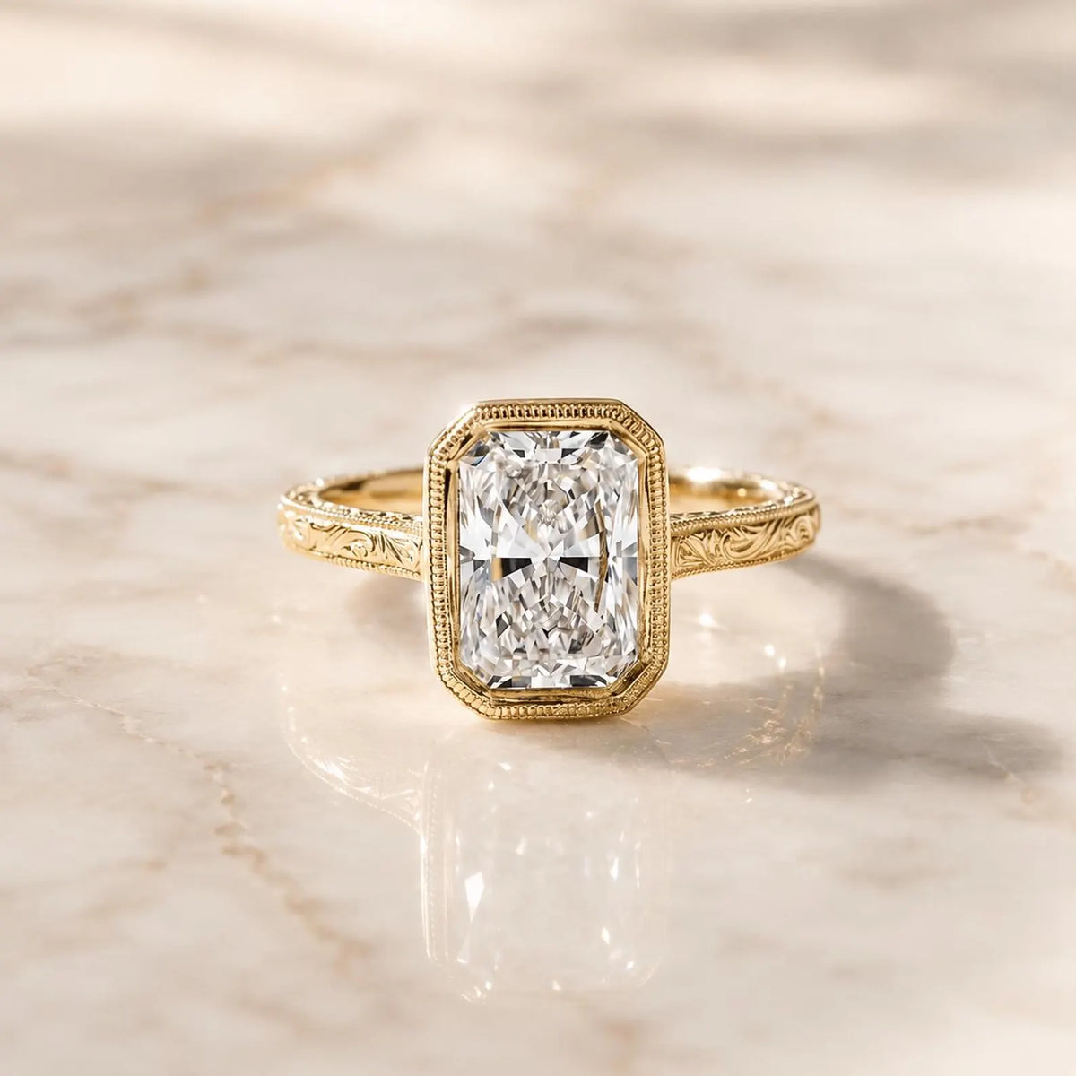Centered top view of a 4 CT radiant cut lab grown diamond with a milgrain-detailed bezel border and engraved yellow gold band.