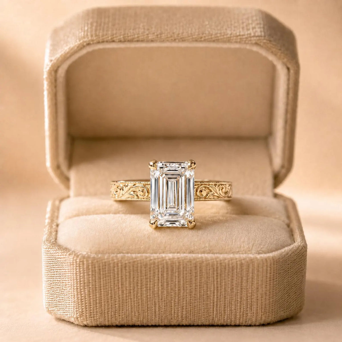 4 CT emerald cut lab grown diamond yellow gold vintage ring displayed inside a beige velvet ring box.