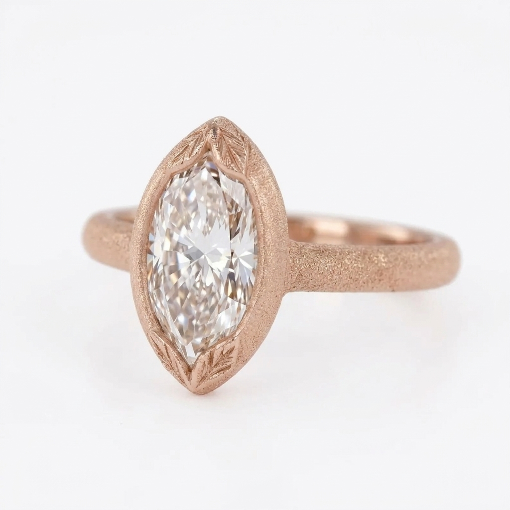 Angled view of a 4 CT marquise cut lab grown diamond ring set in matte rose gold with leaf details on the bezel tips.