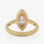 Inner shank and profile view of a yellow gold 4 CT marquise lab diamond ring displaying the under-bezel construction.