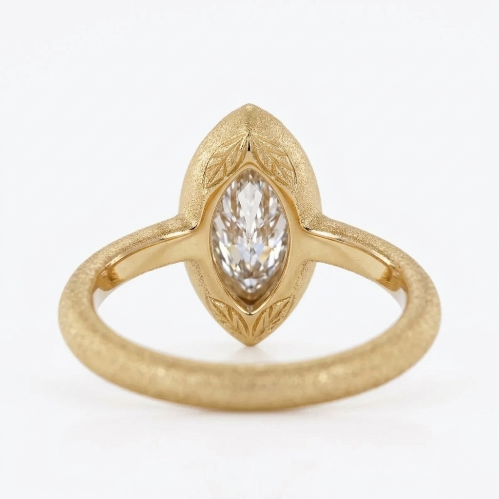 Inner shank and profile view of a yellow gold 4 CT marquise lab diamond ring displaying the under-bezel construction.