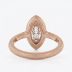 Profile view showing the inside ring shank and leaf bezel tips of a rose gold marquise lab-grown diamond ring.