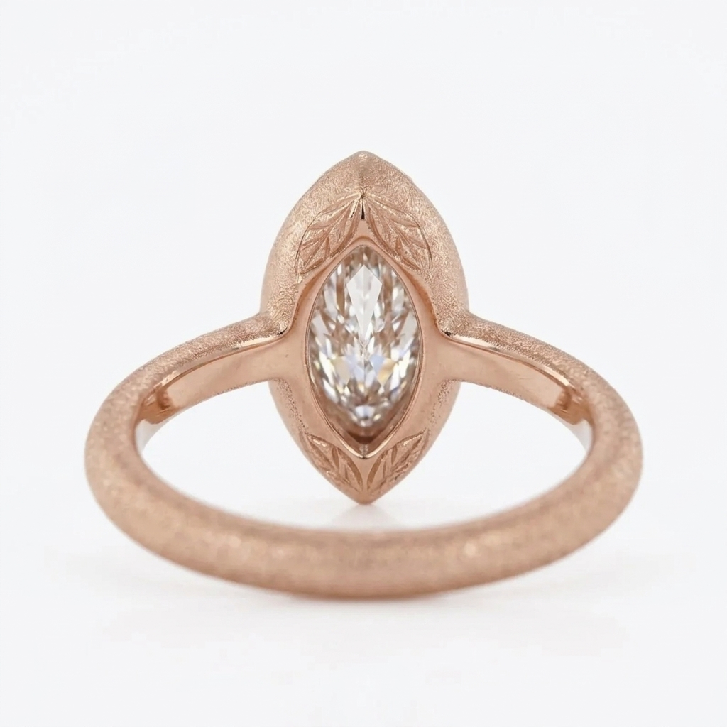 Profile view showing the inside ring shank and leaf bezel tips of a rose gold marquise lab-grown diamond ring.