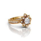 Perspective side view of a 3 CT round cut lab grown diamond ring in yellow gold with an intricate floral lotus halo and milgrain band.