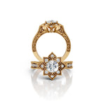 Full profile and top view showing side leaf engraving and floral undercarriage of a 3 CT round lab diamond vintage yellow gold ring.
