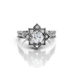 Centered front view highlighting the 3 carat round lab-grown center stone surrounded by antique-style milgrain floral petals in white gold.