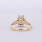 Bottom angle view showing the sculpted petal basket and shank of a 3 CT oval diamond ring.