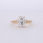 Top-down view of a 3 CT oval cut lab grown diamond set in a yellow gold split shank ring.