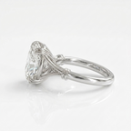 Side angle perspective of a 3 carat oval lab grown diamond ring with woven wire setting in white gold.