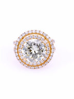 Top view of a 5 CT round cut lab grown diamond engagement ring featuring a double halo and yellow gold setting.