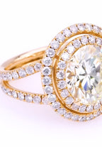 Angle top view of a 5 CT round lab grown diamond ring with double halo and diamond-set split shanks.