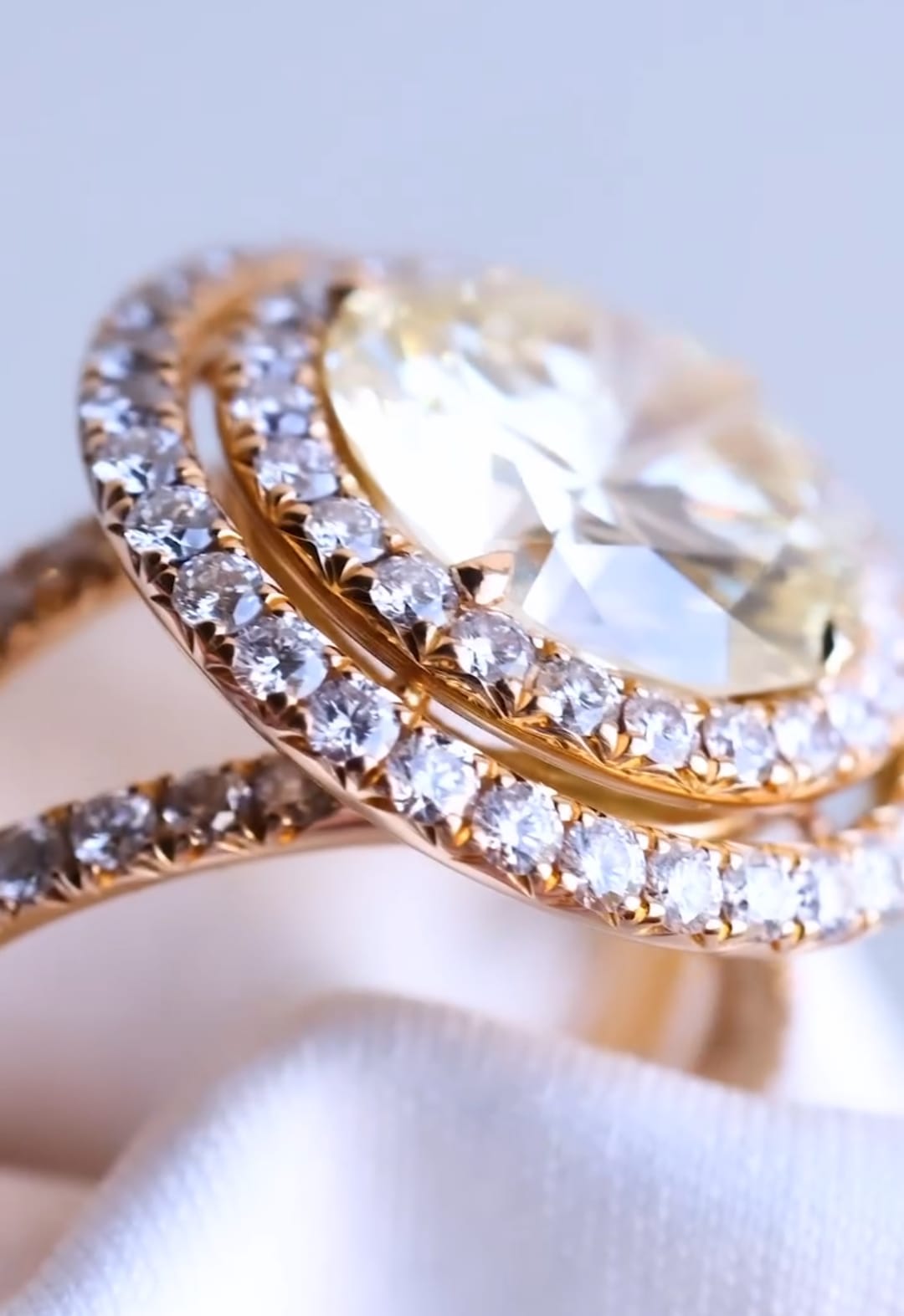 High angle close-up of a 5 CT round lab grown diamond with a tiered double halo setting.