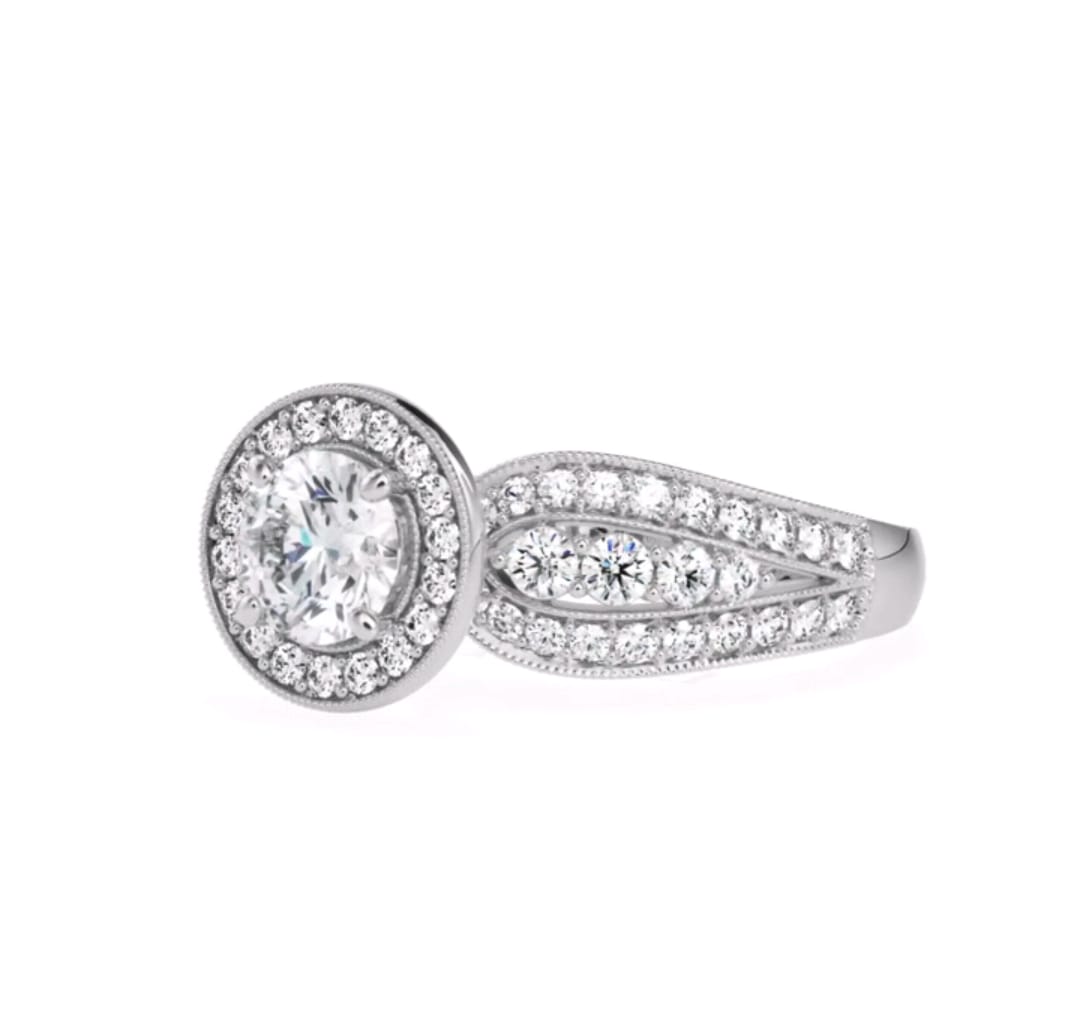 Angle view of a 3 CT round lab grown diamond vintage halo ring with 3-row split shank in white gold.