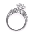 Full side profile view showing filigree scrollwork and surprise side diamond under a 3 CT round halo setting.
