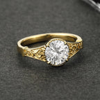 Frontal view showcasing the facet brilliance of a 3 CT round lab grown diamond set in yellow gold filigree.