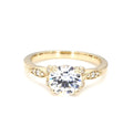 Direct front view of a 3 CT round brilliant lab grown diamond ring with floral side stations in yellow gold.