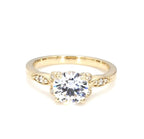 Direct front view of a 3 CT round brilliant lab grown diamond ring with floral side stations in yellow gold.