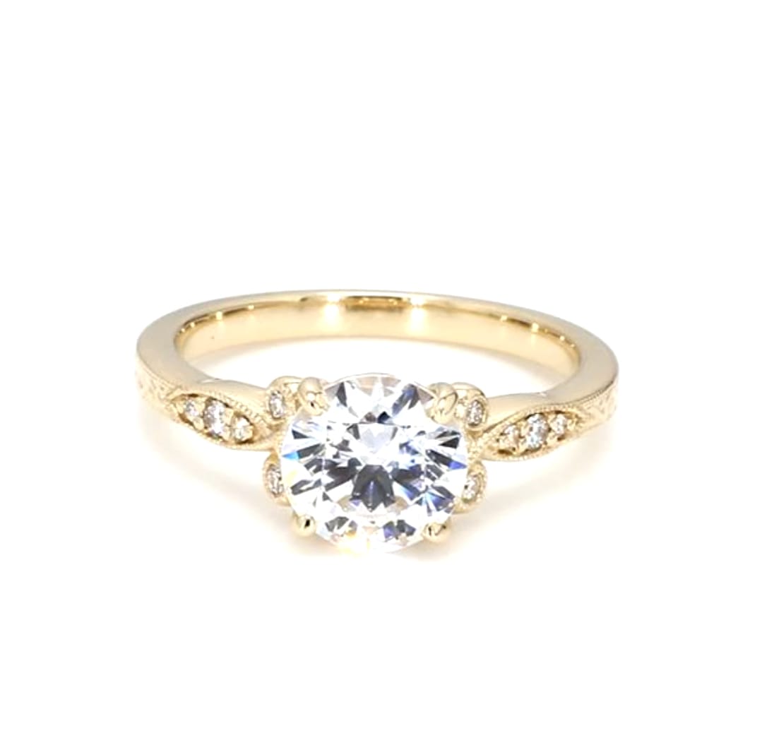 Direct front view of a 3 CT round brilliant lab grown diamond ring with floral side stations in yellow gold.