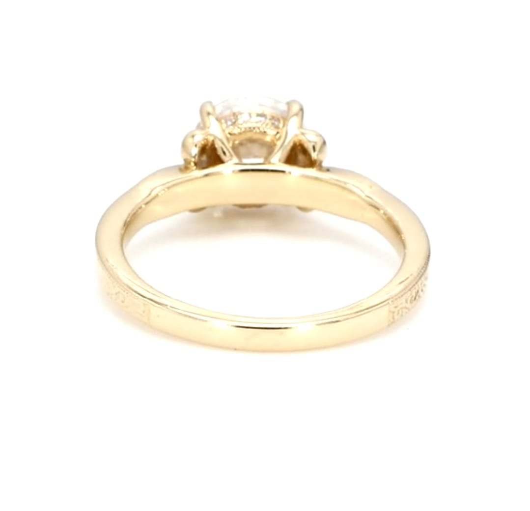 Bottom profile view showing the polished lower band and engraved shoulders of a 3 CT round lab diamond ring.