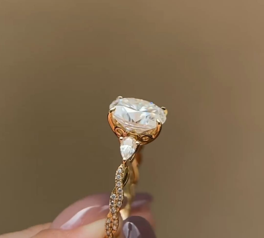 Detailed view of the petal filigree basket setting underneath a 2 CT oval lab grown diamond.
