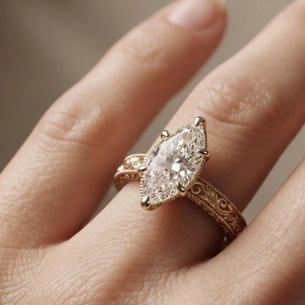 Angled on-finger view of a 4 CT marquise cut lab diamond engagement ring with milgrain accents and yellow gold band.