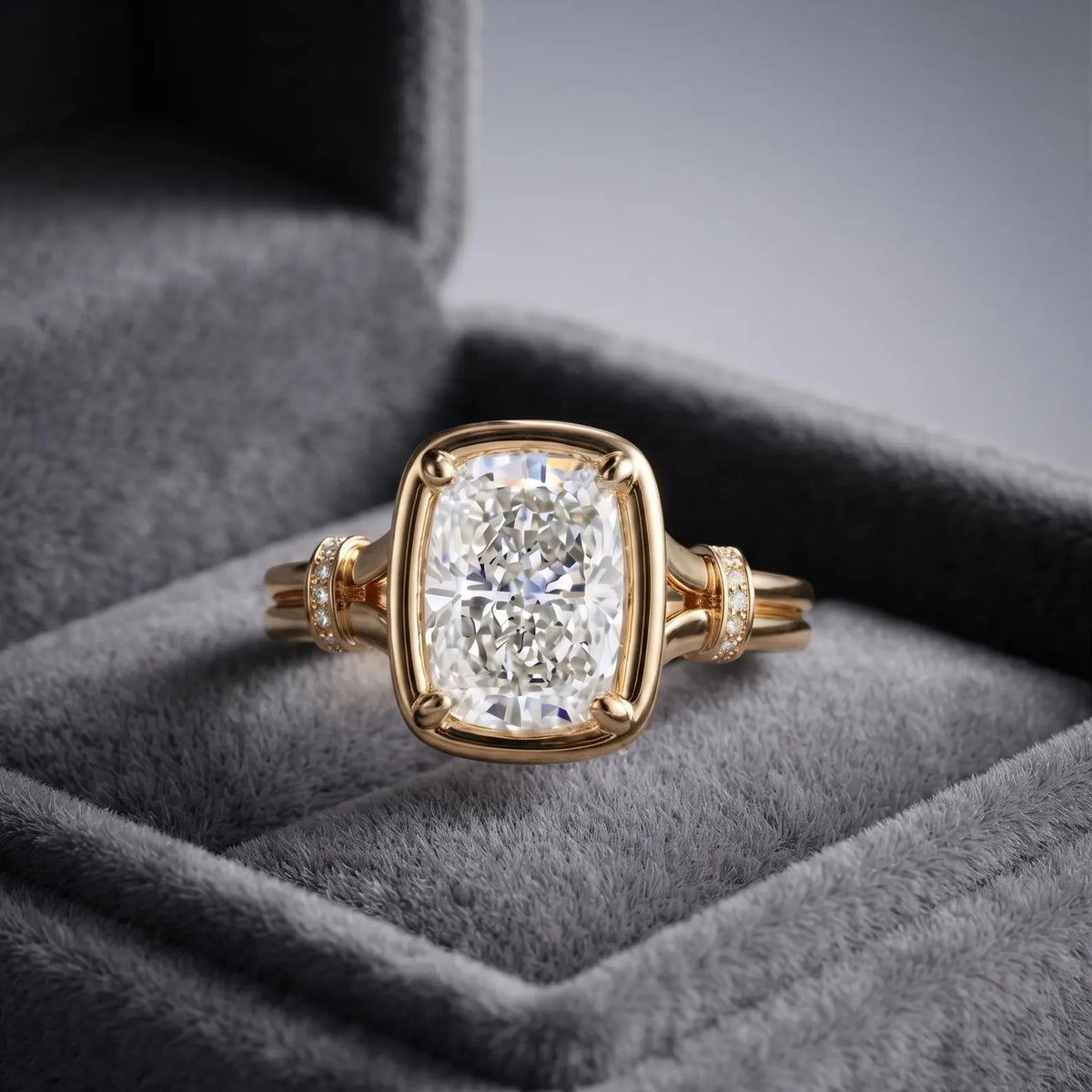 3 CT elongated cushion lab grown diamond ring with split shank band showcased inside a plush gray velvet ring box.
