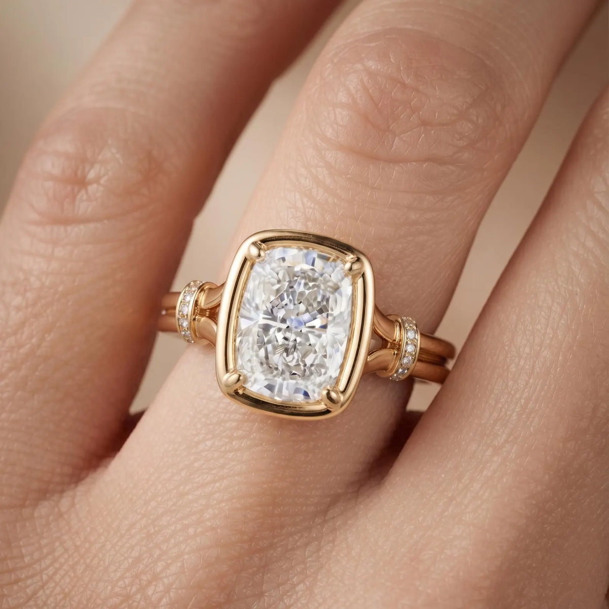 Top-down hand shot showing a 3 CT cushion cut lab diamond ring with double band split shank in yellow gold.