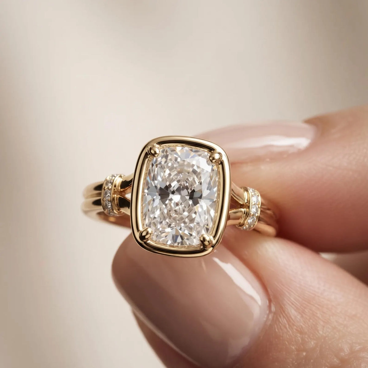 Macro close-up shot held in fingers displaying the bezel frame and diamond pave collar detail of a 3 CT cushion lab diamond ring.
