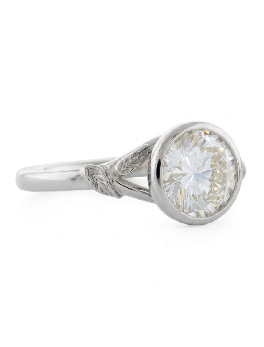 Three-quarter angle view of a 3 CT round lab diamond bezel ring with leaf shank in white gold.