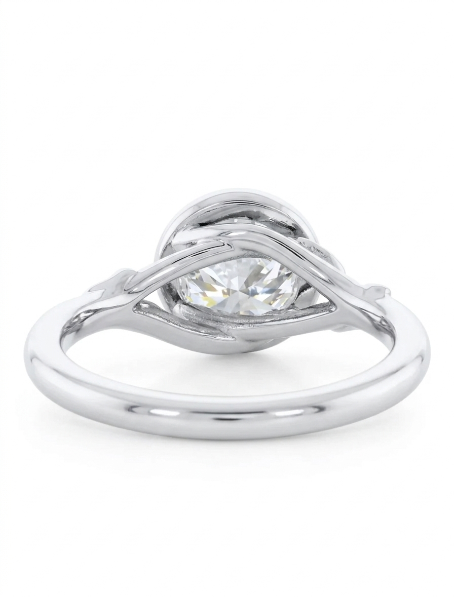 Side profile showing the botanical branch design and bezel setting on a white gold 3 CT round lab diamond ring.