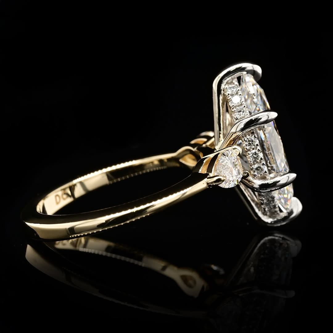 Under-gallery and profile view of a two-tone marquise diamond engagement ring displaying the seamless transition between the white gold basket and slender yellow gold shank.