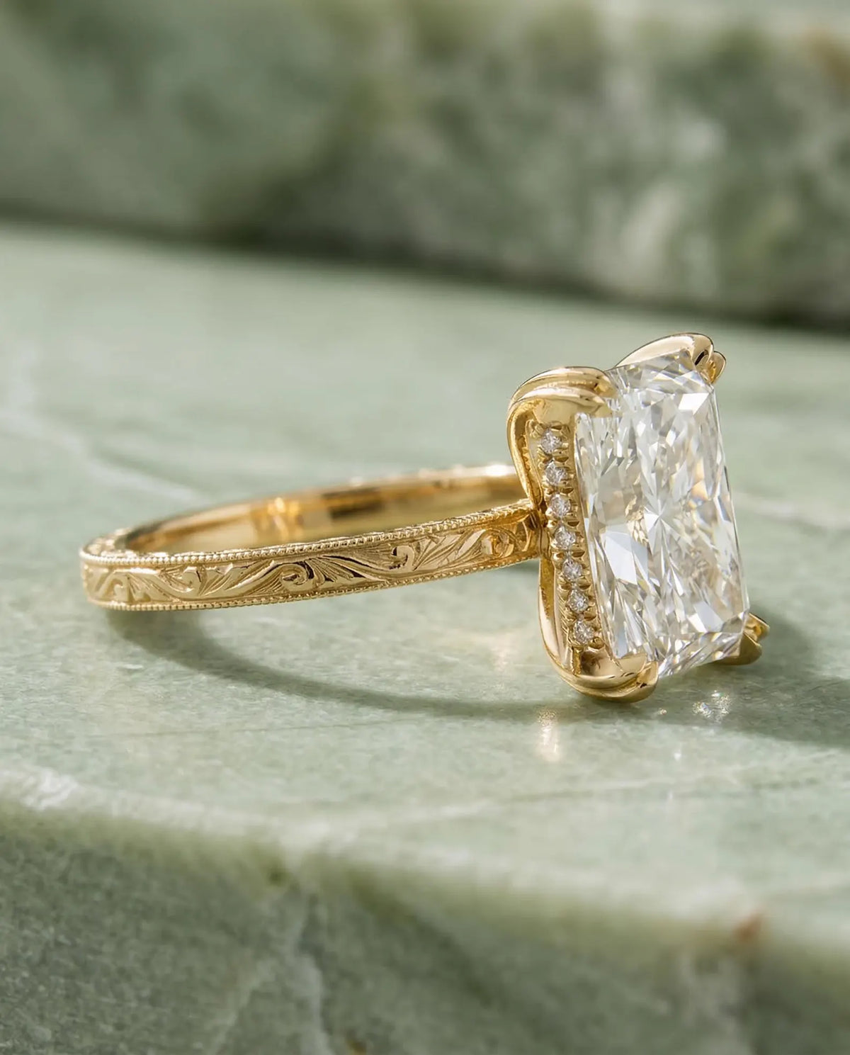 Side profile showing secret hidden halo and hand-carved floral scrollwork on a 4 CT radiant lab diamond ring.